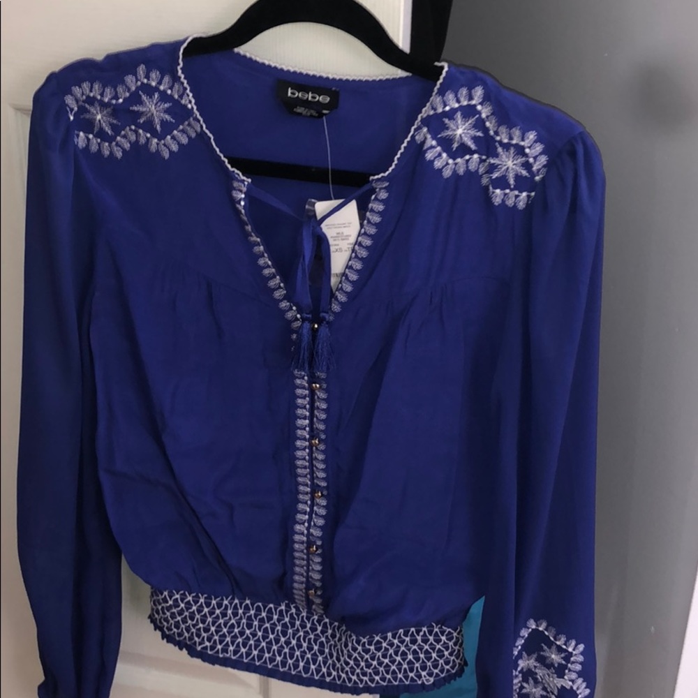 BEBE Blouse. Long sleeve with sheer Arms
